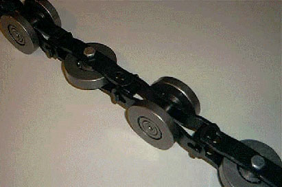 Heavy duty chain with heat treatment for standard enclosed track
